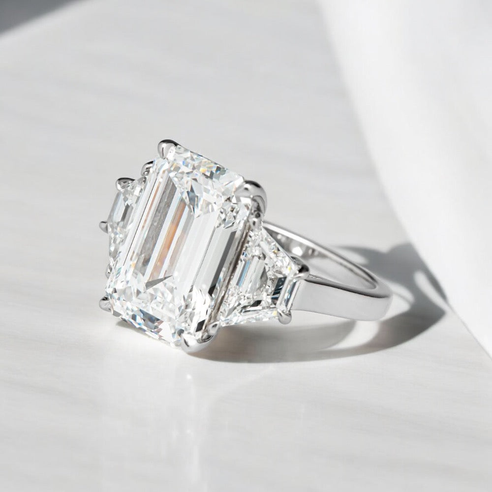 5.6 Carats Emerald Shape Diamond Ring With Baguette Side Stones, 950 Platinum